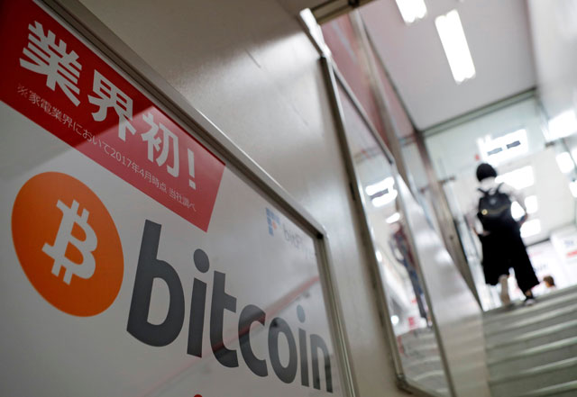 A logo of Bitcoin is seen on an advertisement of an electronic shop in Tokyo, Japan, on September 5, 2017 (Reuters file photo)