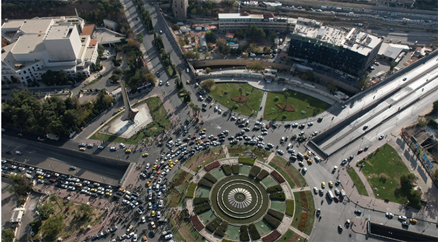 An aerial view shows traffic on the streets in Syria's capital Damascus (AFP via Getty Images)