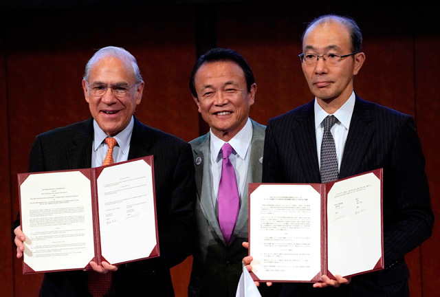 Theis photo shows OECD Secretary General Angel Gurria (left) with Japan’s Finance Minister Taro Aso (centre) and National Tax Agency commissioner Takeshi Fujii after they have signed a memorandum of cooperation for the establishment of a centre of the OECD Academy for Tax and Financial Crime Investigation in Japan, during the G-20 finance ministers and central bank governors meeting in Fukuoka, on Saturday  (AFP photo)