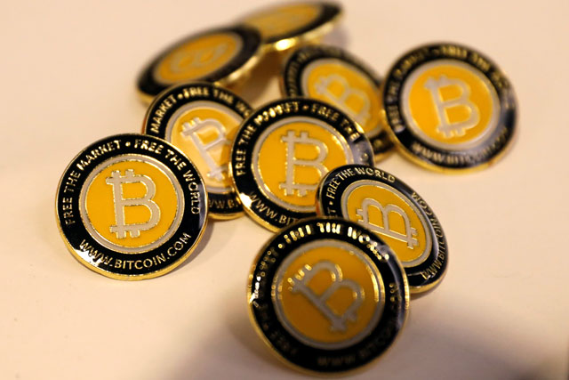 Bitcoin.com buttons are seen displayed on the floor of the Consensus 2018 blockchain technology conference in New York City, New York, US, on Wednesday  (Reuters photo)