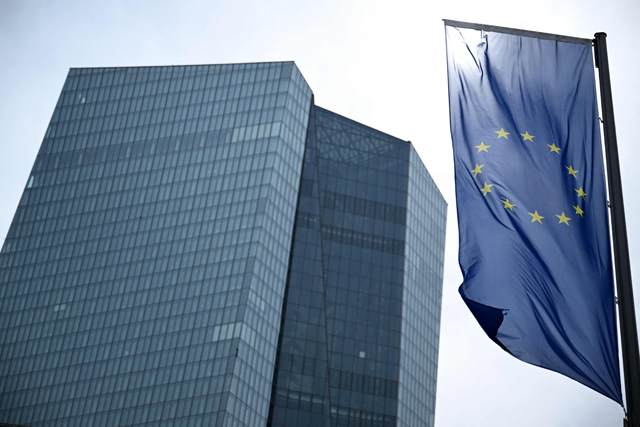 The European flag flutters next to the headquarters of the European Central Bank (ECB) in Frankfurt am Main, western Germany, on Thursday, ahead of an ECB press conference on Eurozone monetary policy (AFP photo)