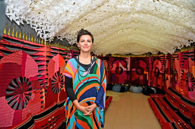   Artist and architectural historian Azra Aksamija is seen in her textile art installation at Sharjah Museum for Islamic Civilisation in the UAE (Photo courtesy of SMIC)