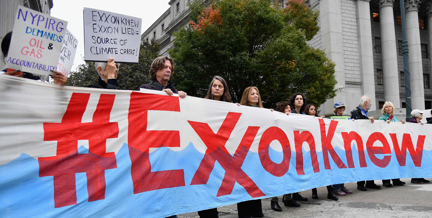 Climate activists protest on the first day of the Exxon Mobil trial outside the New York State Supreme Court building on October 22, 2019 in New York City (AFP file photo)