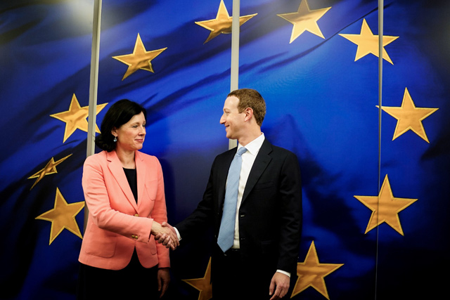 European Commission Vice President in charge for Values and Transparency Vera Jourova (left) shakes hands with the founder and CEO of US online social media and social networking service Facebook Mark Zuckerberg (right), in Brussels, on Monday (AFP photo)