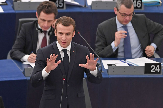 French President Emmanuel Macron speaks at Elysee Palace as General Secretary Alexis Kohler (right) listens during a session of the European Parliament in the eastern French city of Strasbourg, on Tuesday (AFP photo)