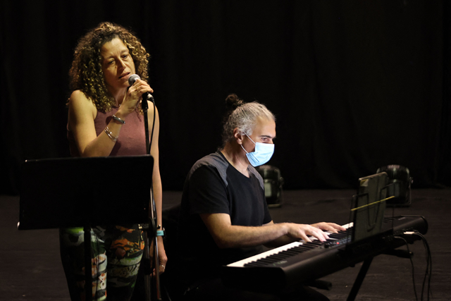 Lebanon's music national conservatory teacher, composer and saxophonist Nidal Abu Samra rehearses with singer Sarah Kouzi at Al Madina theatre in Beirut on April 17, 2023, ahead of a concert (AFP photo)