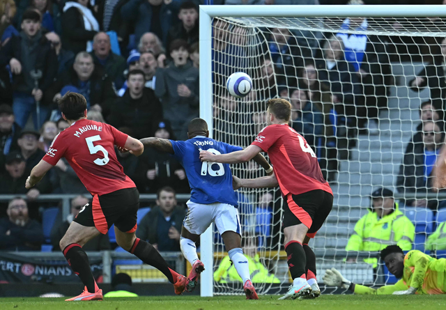 Manchester United's Dutch defender #04 Matthijs de Ligt fouls Everton's English defender #18 Ashley Young to concede a penalty during the English Premier League football match between Everton and Manchester United at Goodison Park in Liverpool, north west England on Saturday (AFP photo)