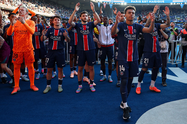 PSG players celebrate after winning the match and the French championship title at The Parc des Princes Stadium in Paris on Sunday (AFP photo)