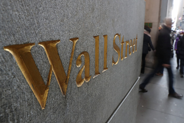 A street sign, Wall Street, is seen outside the New York Stock Exchange in New York City, New York, US, on Thursday (Reuters photo)