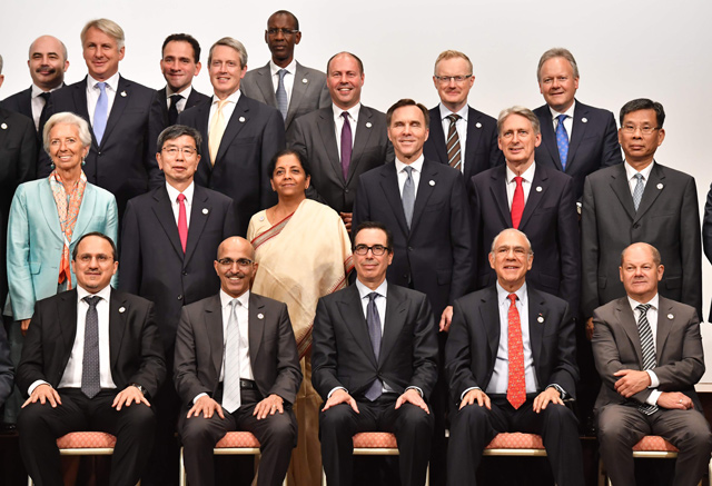 IMF Managing Director Christine Lagarde (second row left), US Treasury Secretary Steven Mnuchin (front centre), China’s Finance Minister Liu Kun (second row right) and other delegation members pose in a family photo session at the G-20 finance ministers and central bank governors meeting in Fukuoka on Sunday  (AFP photo)
