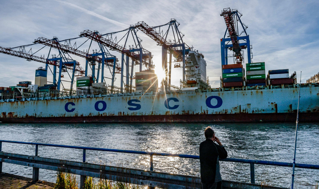 In this file photo taken on October 26, 2022 the container ship 'COSCO Pride' of China COSCO Shipping Corporation is unloaded at the Tollerort Container Terminal owned by HHLA, in the harbour of Hamburg, northern Germany (AFP photo)