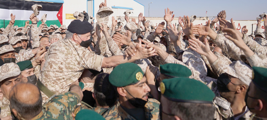 His Majesty King Abdullah, the Supreme Commander of the Jordan Armed Forces-Arab Army,  greets  Border Guards personnel at the Eastern Military Zone on Monday (Photo courtesy of Royal Court)