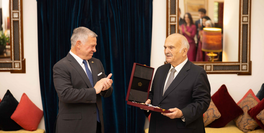His Majesty King Abdullah bestows the Order of the State Centennial on HRH Prince Hassan on Monday (Photo courtesy of Royal Court)