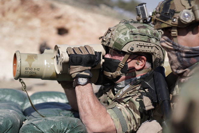 His Majesty King Abdullah, the Supreme Commander of the Jordan Armed Forces-Arab Army, joins special forces personnel in an exercise simulating the elimination of terrorist elements and smugglers on Monday  (Photo courtesy of Royal Court)
