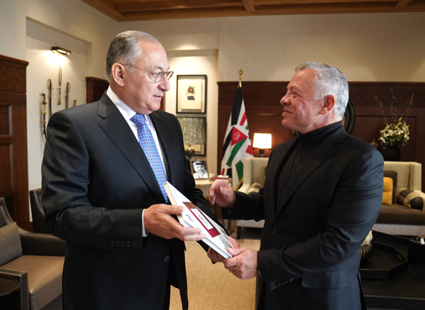 His Majesty King Abdullah receives a copy of the Jordan Integrity and Anti-Corruption Commission’s annual report from IACC Chairman Muhannad Hijazi (Photo courtesy of Royal Court)