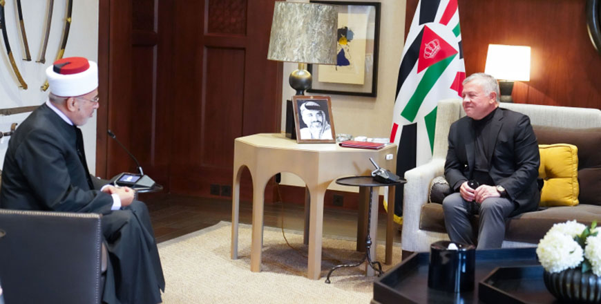 His Majesty King Abdullah receives a copy of the annual report on Sharia Courts and their conduct of business for the year 2020 on Sunday (Photo courtesy of Royal Court)