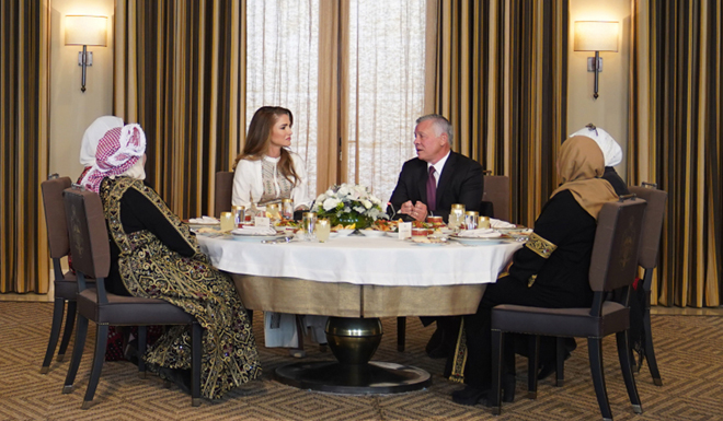 Their Majesties King Abdullah and Queen Rania meet with Jordanian women from several governorates at Al Husseiniya Palace on Monday (Photo courtesy of Royal Court)