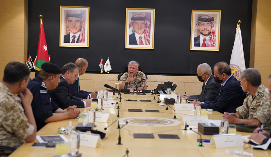 His Majesty King Abdullah chairs a meeting at the National Centre for Security and Crisis Management on Tuesday to follow up on the latest developments related to the gas leak incident in Aqaba. HRH Crown Prince Hussein participated via telepresence from Aqaba (Photo courtesy of Royal Court)