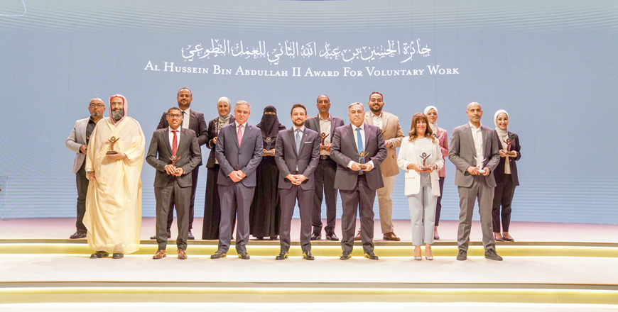 HRH Crown Prince Hussein poses for a group photo with winners of Al Hussein bin Abdullah II Award for Voluntary Work at the Cultural Palace on Monday (Photo courtesy of Royal Court)