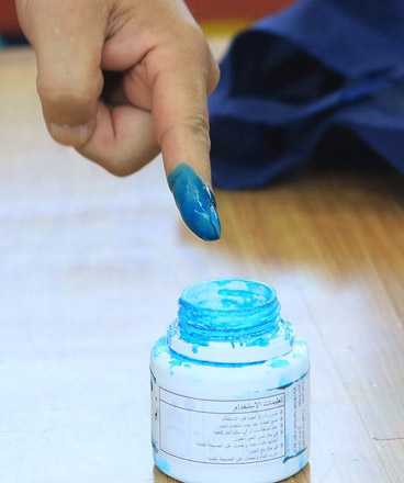 The ink-marked index finger of a voter is seen at a polling station in Amman on Tuesday (Photo by Osama Aqarbeh)