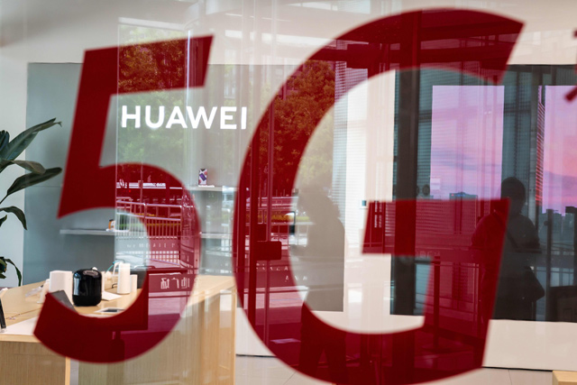 A shop for Chinese telecom giant Huawei features a red sticker reading ‘5G’ in Beijing on May 25  (AFP photo)