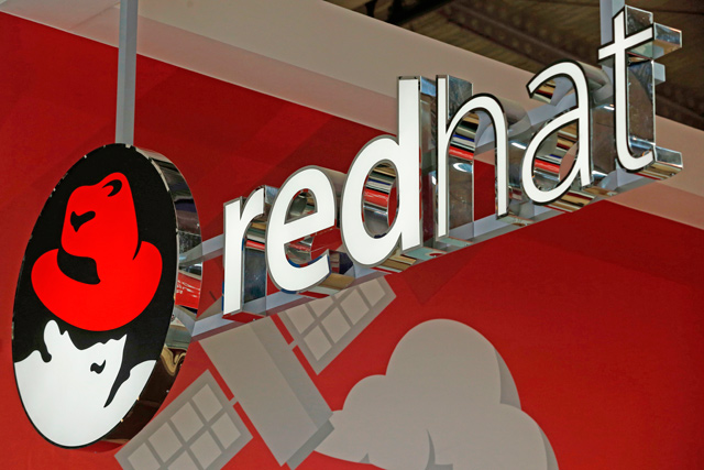 In this file photo taken on February 26, the logo of Red Hat Software is photographed at the Mobile World Congress, the world's biggest mobile fair in Barcelona (AFP photo)