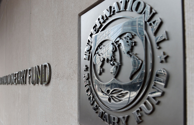 The photo shows an exterior view of the building of the International Monetary Fund with its logo, on March 27, in Washington, DC (AFP file photo)