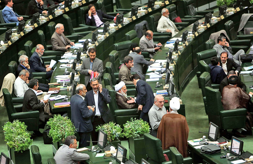 Iranian members of parliament attend a parliamentary session in Tehran on Tuesday (AFP photo)