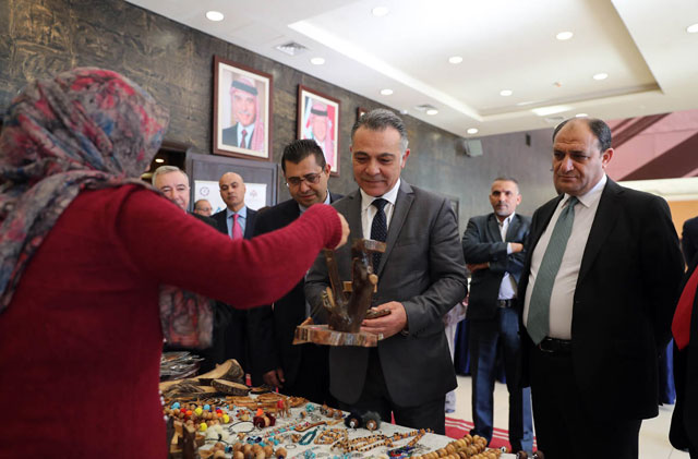 Minister of Planning and International Cooperation Wissam Rabadi hears the success stories of entrepreneurs supported by the ministry’s IRADA programme at Al Hussein Youth City on Thursday (Petra photo)