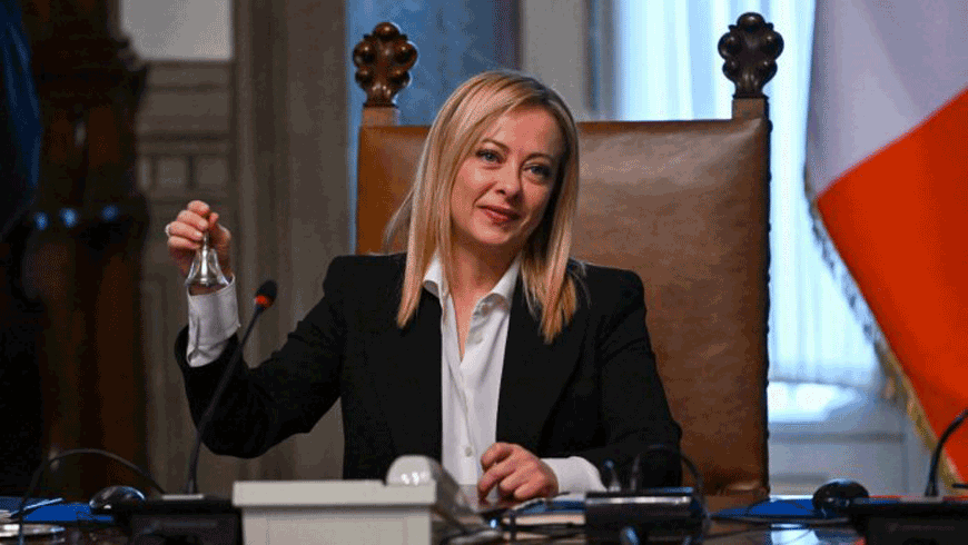 Italy's new Prime Minister Giorgia Meloni rings the bell as she presides over her government's first Cabinet meeting on October 23 (AFP file photo)
