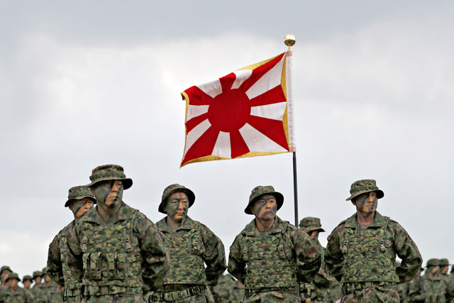 Soldiers of Japanese ground self-defence force amphibious (JGSDF) rapid deployment brigade, Japan's first marine unit since World War II, gather at a ceremony activating the brigade at JGSDF's Camp Ainoura in Sasebo, on the southwest island of Kyushu, Japan, on Saturday (Reuters photo)