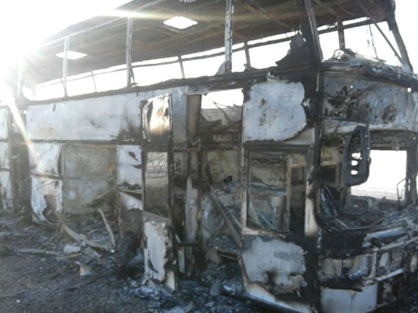 A view shows a burnt-out bus in which people travelling on a route used by migrant workers heading to Russia died in a fire, in the Aktobe region, Kazakhstan, on Thursday (Reuters photo)