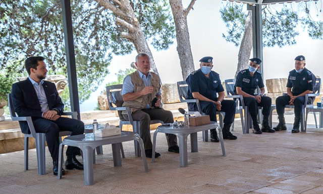 His Majesty King Abdullah, accompanied by HRH Crown Prince Hussein, meets with heads of divisions at the Royal Department for Environment Protection and Tourism at Mount Nebo in Madaba on Monday (Photo courtesy of Royal Court)
