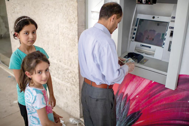   One of UNHCR’s key protection mechanisms for refugees in Jordan is cash assistance, which allows refugees to meet their basic needs in a dignified manner, pay their rent, food and healthcare costs, the UN agency said (Photo courtesy of UNHCR)