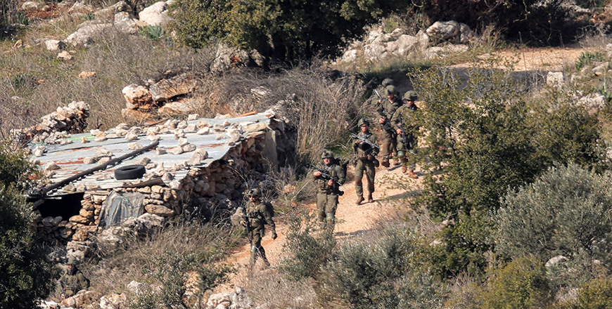 Israeli army forces patrol in the village of Kfarshuba in southern Lebanon today (AFP photo)