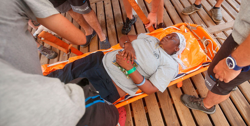 Josepha, a 40-year-old woman from Cameroon who was rescued at sea, lies on a stretcher on board the Proativa Open Arms boat before disembarking in Palma de Majorca on Saturday. Two vessels of Spanish NGO Proativa Open Arms involved in rescuing migrants in the Mediterranean arrived in the Spanish port of Palma carrying a woman found drifting on a deflated dinghy off Libya as well as the bodies of a boy and another woman (AFP photo)