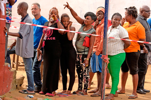 Liberians queue to cast their ballots at a polling station during the second round of presidential elections in Monrovia on Tuesday (AFP photo)