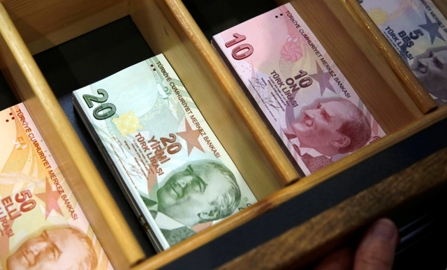 Turkish lira banknotes are photographed at a currency exchange office in Istanbul, Turkey, on  August 13 (Reuters file photo)