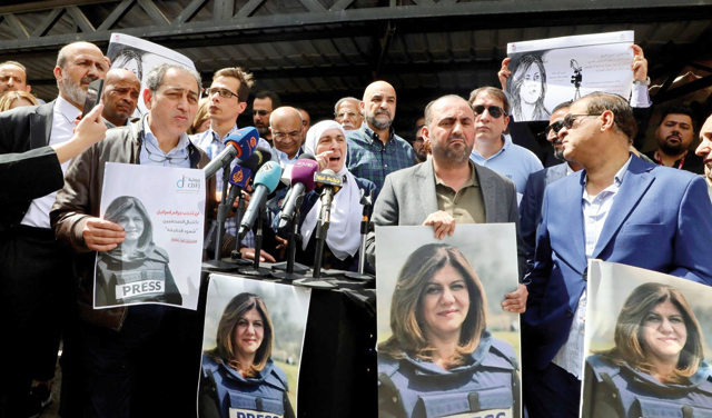 Journalists and activists gather in front of Al Jazeera’s headquarters in Amman to protest the killing of the channel's veteran reporter Shireen Abu Akleh in the occupied West Bank town on Wednesday (Photo by Osama Aqarbeh)