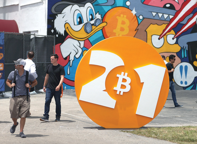 People enjoy themselves at the Bitcoin 2021 Convention, a cryptocurrency conference held at the Mana Convention Centre in Wynwood on Friday in Miami, Florida (AFP photo)