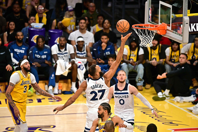 Minnesota Timberwolves French centre #27 Rudy Gobert drives to the basket during the NBA game season opener between the Los Angeles Lakers and the Minnesota Timberwolves at Crypto Arena in Los Angeles on Wednesday (AFP photo)