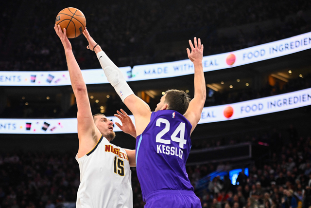 Nikola Jokic #15 of the Denver Nuggets attempts a shot over Walker Kessler #24 of the Utah Jazz during the second half of a game at Delta Centre on Tuesday in Salt Lake City, Utah (AFP photo)