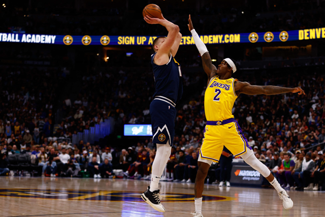 Nikola Jokic #15 of the Denver Nuggets shoots over Jarred Vanderbilt #2 of the Los Angeles Lakers during the third quarter at Ball Arena on Saturday in Denver, Colorado (AFP photo)