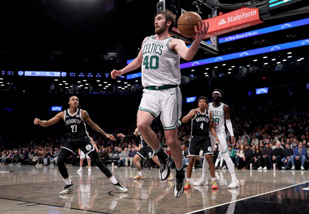 Luke Kornet #40 of the Boston Celtics keeps the ball in bounds as Maxwell Lewis #27 of the Brooklyn Nets looks on during the second half at Barclays Centre on Sunday in the Brooklyn borough of New York City (AFP photo)