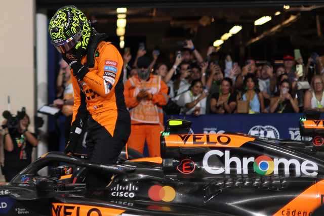 McLaren's British driver Lando Norris steps out of his car after claiming pole position in the qualifying session ahead of the Abu Dhabi Formula One Grand Prix at the Yas Marina Circuit in Abu Dhabi on Saturday (AFP photo)