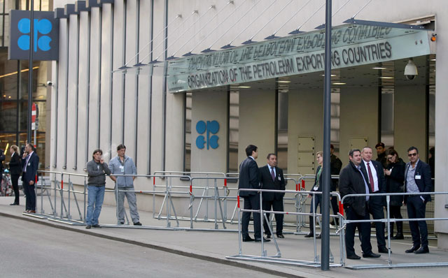 Persons stand in front of the headquarters of the Organisation of the Petroleum Exporting Countries in Vienna, Austria, on Saturday (AP photo)