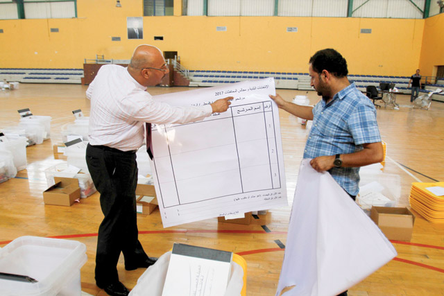 Election officials make preparations at a voting centre on the eve of local elections in Amman   (Photo by Osama Aqarbeh)