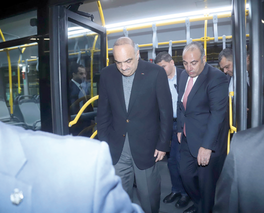 Prime Minister Bisher Khasawneh during the inaugural trips of the Amman Bus Project’s second phase on Thursday (Petra photo)