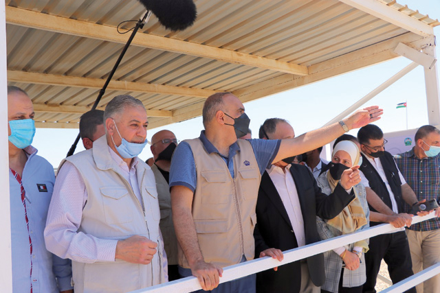 Prime Minister and Minister of Defence Bisher Al Khasawneh checks on a project during his visit to the southern Jordan Valley on Saturday (Petra photo)