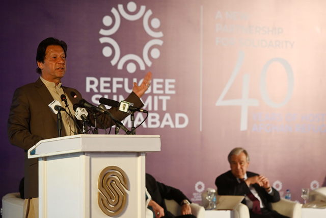 Pakistan's Prime Minister Imran Khan (left) delivers a speech next to United Nations Secretary General Antonio Guterres (right) during the Refugee Summit Islamabad to mark 40 years of hosting Afghan refugee in Islamabad on Monday (AFP photo)
